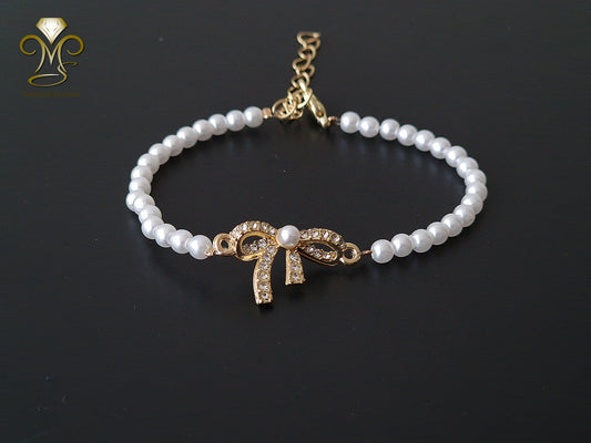 Trendy ketting en schakel parelmoer gouden armband